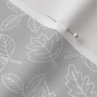 Delicate Scandinavian boho style autumn leaves oak maple and birch light soft gray baby nursery