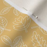 Delicate Scandinavian boho style autumn leaves oak maple and birch ochre yellow honey baby nursery 