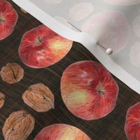autumn fruit: walnut and apple on dark texture