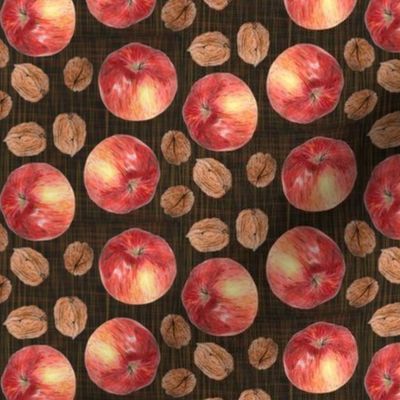 autumn fruit: walnut and apple on dark texture