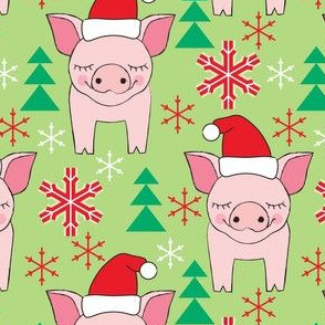 large pink christmas pigs on green