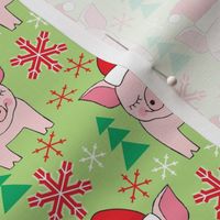 medium pink christmas pigs on green