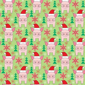 small pink christmas pigs on green