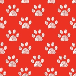 Doodle white paw print seamless fabric design repeated pattern with red background