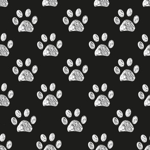 Doodle white paw print seamless fabric design repeated pattern with black background