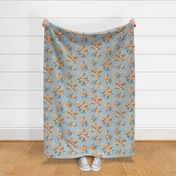 Large // blooming Citrus oranges on blue