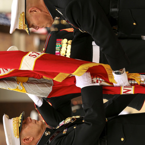  97-19 General Robert B. Neller, 37th Commandant of the Marine Corps, passes the Marine Corps Battle Color to Gen. David H. Berger, 38th Commandant of the Marine Corps