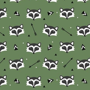 Racoons on green background. Small scale