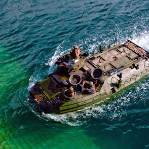 101-1  An amphibious assault vehicle returns to the amphibious dock landing ship USS Gunston Hall