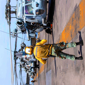 101-8 Sailors and Marines assigned to the amphibious assault ship USS Bataan (LHD 5) prepare for flight operations,