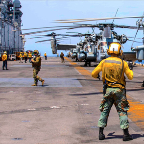 101-9 Sailors and Marines assigned to the amphibious assault ship USS Bataan (LHD 5) prepare for flight operations,