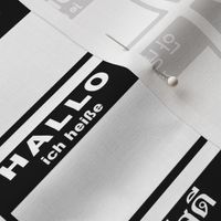 multilingual cut-and-sew 'Hello my name is' labels in a grid -  black and white
