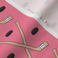 Hockey Sticks and Pucks on Pink