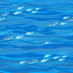 Blue pattern with waves and small fish.
