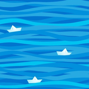 Blue pattern with waves and paper boats.