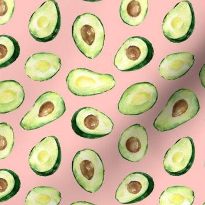 halves of avocado on a  pink background