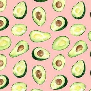 halves of avocado on a  pink background