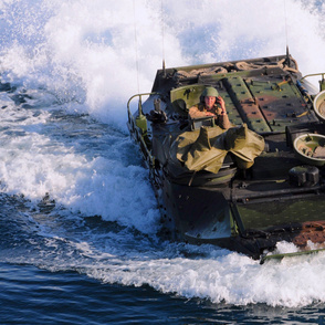 103-12 An amphibious assault vehicle assigned to the 11th Marine Expeditionary Unit (11th MEU) approaches the amphibious assault ship USS Makin Island.