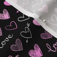 pink and gray hearts on a black background