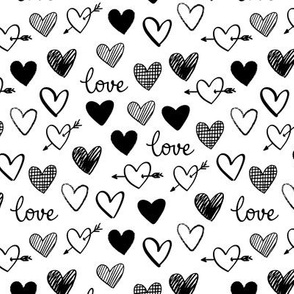 messy black love and hearts on a white background