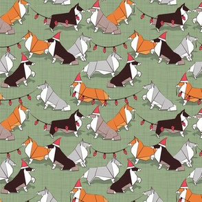 Tiny scale // Origami Christmas Collie friends // sage green linen texture background white orange & brown paper and cardboard dogs red ornaments