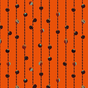 Colorful Christmas Bells on Festive Tinsel Streamers Orange