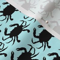 black crabs on light blue