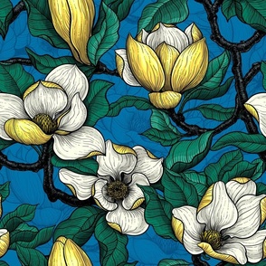 Yellow magnolia with green leaves on dark blue