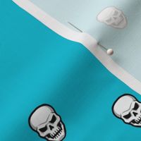 Skulls  Turquoise Blue Background