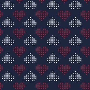 red and white cross stitched heards on navy blue