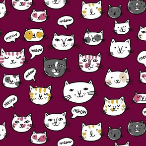 cat heads on burgundy