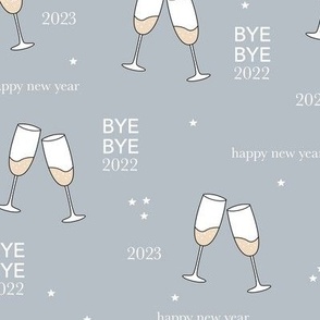 Have a drink - Happy new year 2023 celebration champagne bubbles toast soft stone blue gray night stars typography