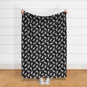 Trotting uncropped White Boxers and paw prints - black