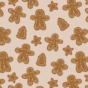 Little Christmas cookies and gingerbread men soft beige sand