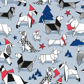 Small scale // Origami Christmas doggie friends // pastel blue background black and white dog breeds with red and classic blue Santa hats stars Holiday socks trees and mountains