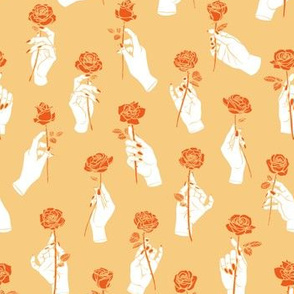 Hands Holding Roses in Orange