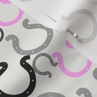Pink horseshoes on gray