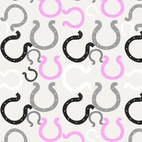 Pink horseshoes on gray