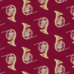 french horn on dark red
