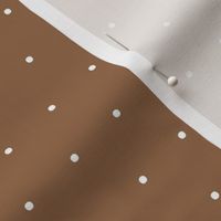 White polka dot spots on brown