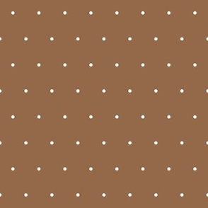 White polka dot spots on brown