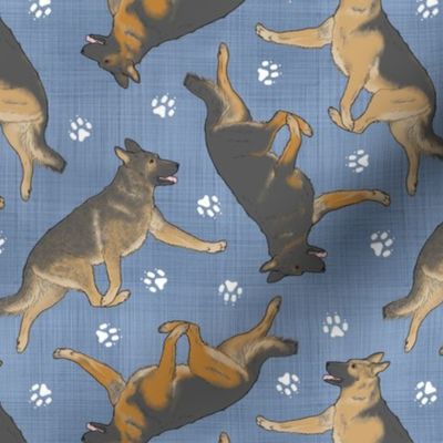 Trotting German Shepherd dogs and paw prints - faux denim