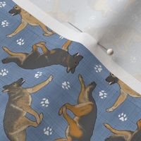 Tiny Trotting German Shepherd dogs and paw prints - faux denim