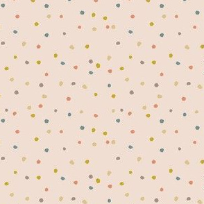 Earth tone small dots on warm beige background 