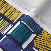 Normal scale // Find the needle // navy blue background gradients of blue and yellow thread spools