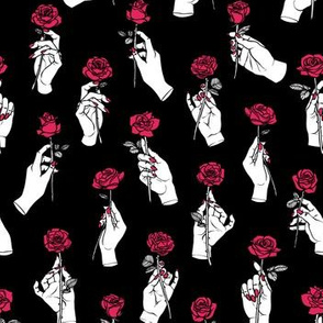 Hands Holding Red Roses on Black