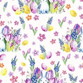 Watercolor Easter bunnies in spring flowers