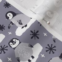 Cute penguins. Gray background