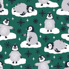 Cute penguins. Emerald background