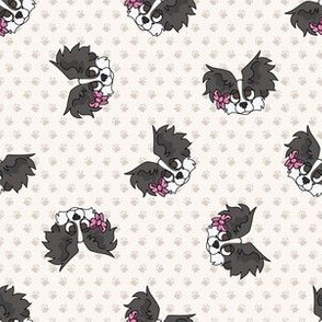  Hand drawn cute papillon dog with pink bow seamless pattern. 